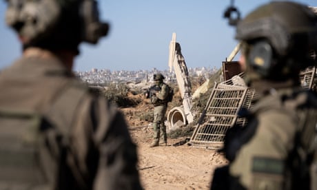 Middle East crisis live: Israeli military says troops have encircled Khan Younis after 24 soldiers killed in Gaza