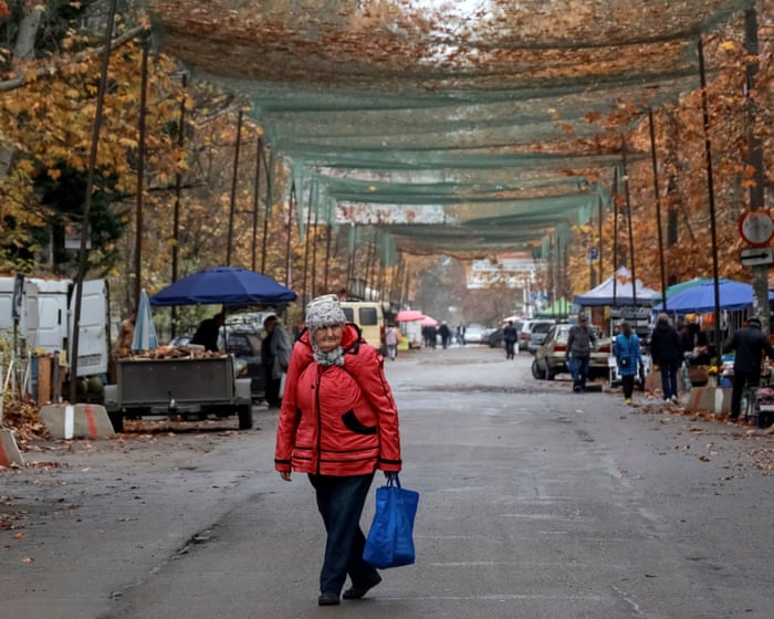 ‘It’s not just about surviving’: the Ukrainian frontline city where life goes on under cover